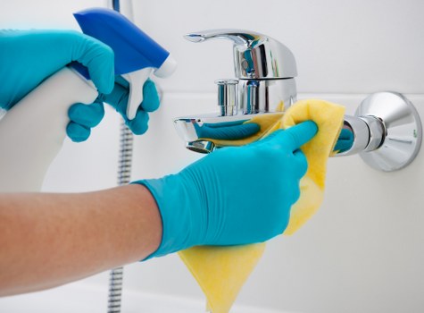 Staff managing hazards during a carpet cleaning service
